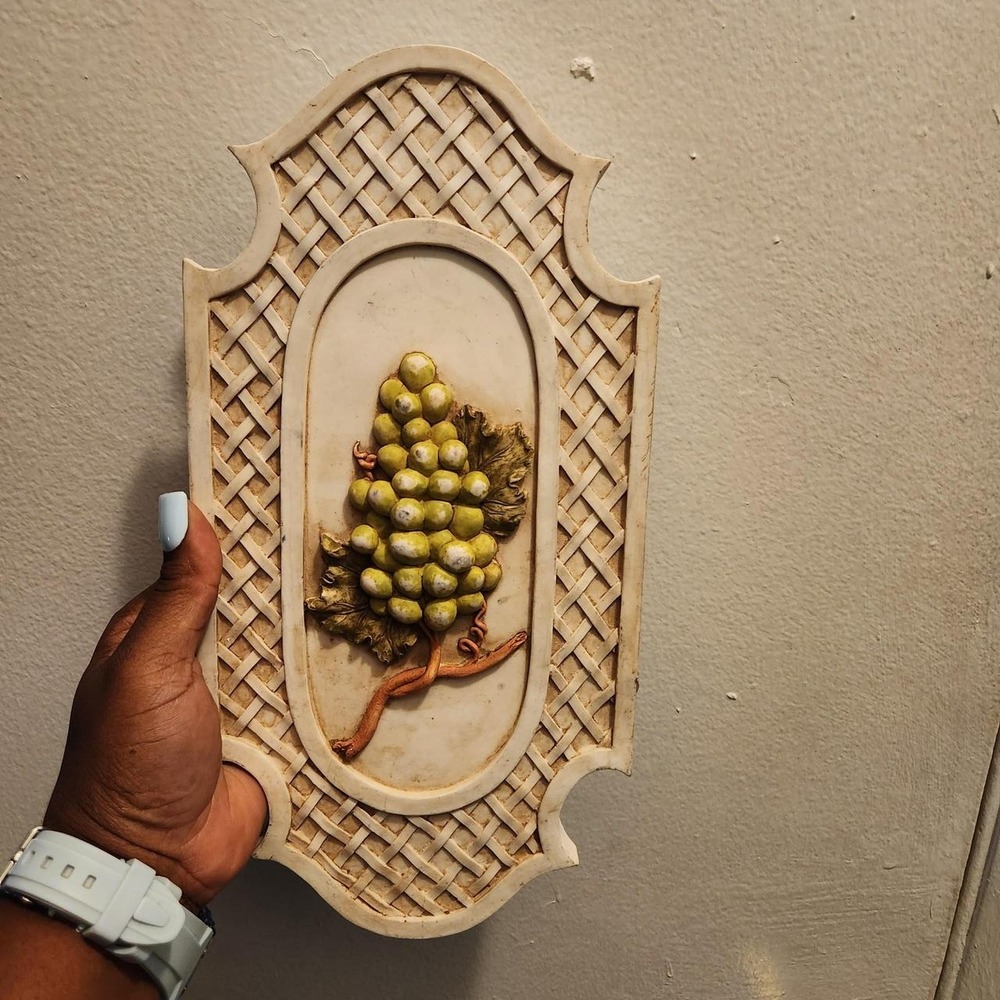 Vintage wall plaque with grapevine design